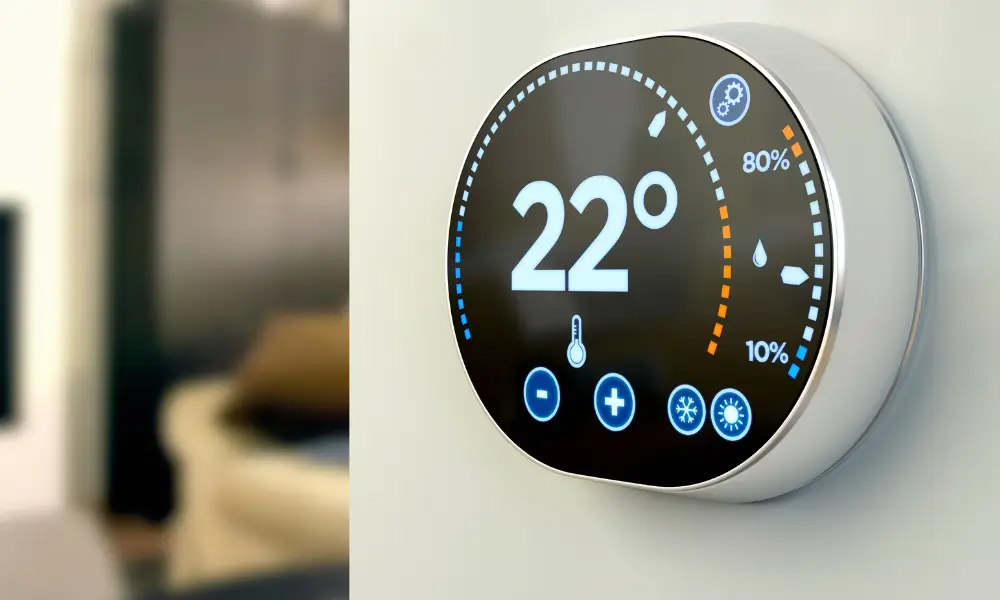 Smart thermostat displaying a temperature of 22 degrees Celsius, with humidity and control icons on a digital screen.